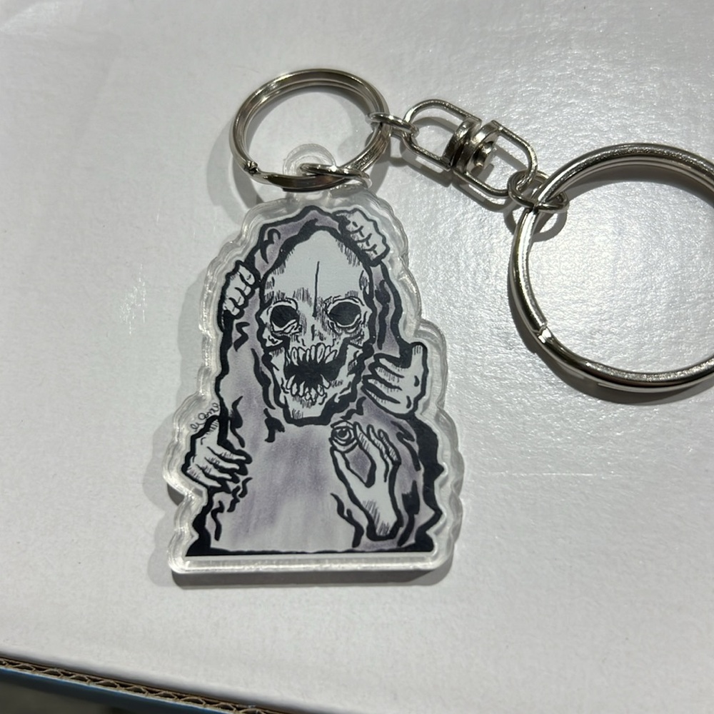 Skeleton face double sided keychain